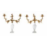 A PAIR OF CUT GLASS AND GILT METAL MOUNTED TWO ARM CANDELABRA