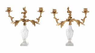 A PAIR OF CUT GLASS AND GILT METAL MOUNTED TWO ARM CANDELABRA