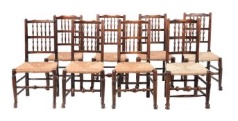 A HARLEQUIN SET OF ASH LADDER BACK DINING CHAIRS