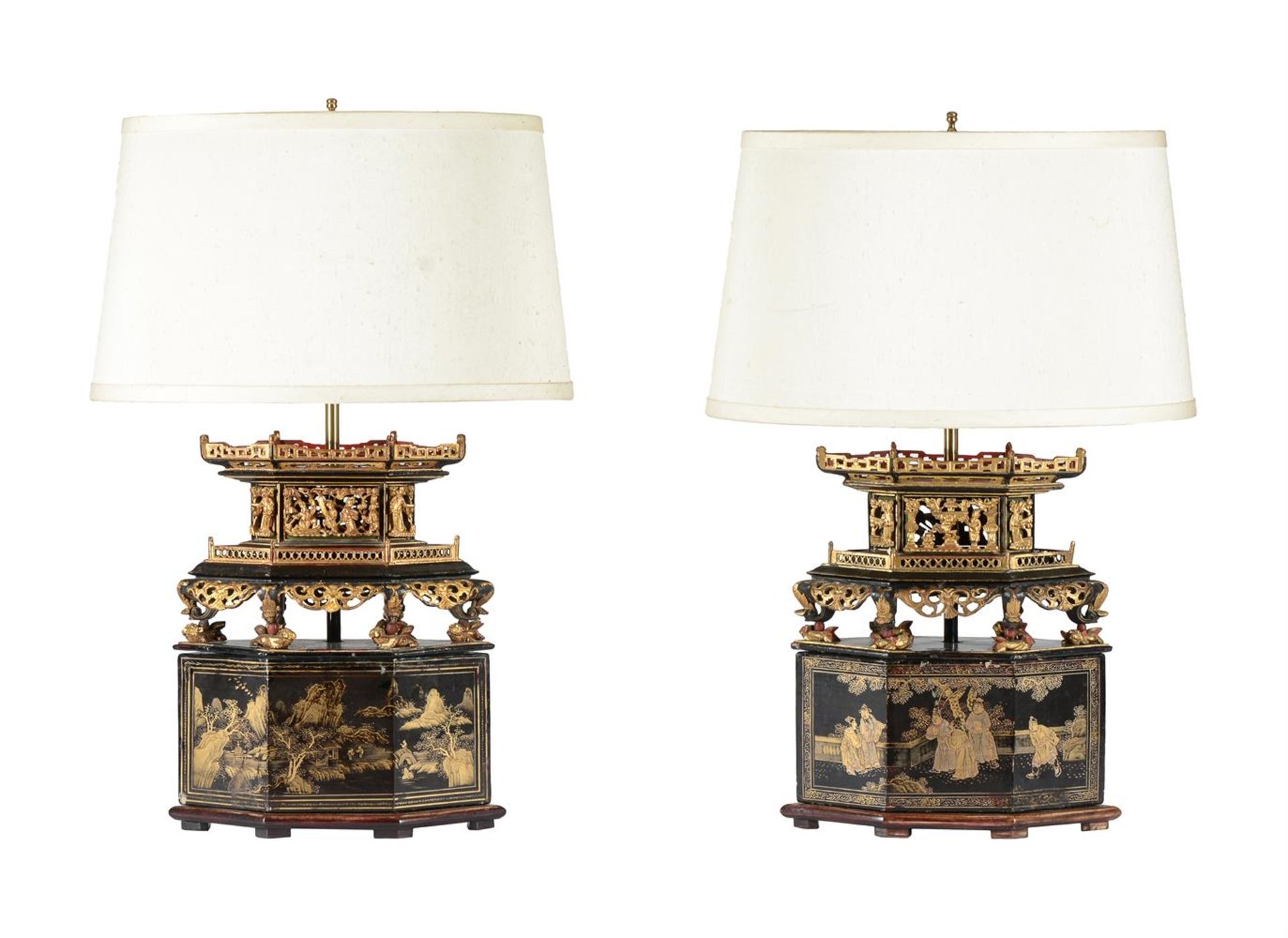 A PAIR OF CHINESE EBONISED AND CARVED GILTWOOD BLACK LACQUER LAMP BASES