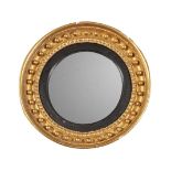 A GILTWOOD AND COMPOSITION CONVEX WALL MIRROR