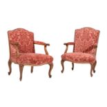 TWO WALNUT AND RED VELVET UPHOLSTERED OPEN ARMCHAIRS