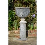 A FRENCH LEAD GARDEN URN ON PEDESTA