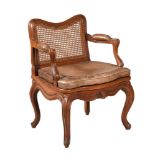 A FRENCH WALNUT AND CANED OPEN ARMCHAIR