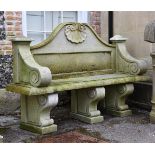 A STONE COMPOSITION GARDEN SEAT IN GEORGE II STYLE