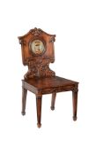 A MAHOGANY HALL CHAIR IN THE REGENCY MANNER