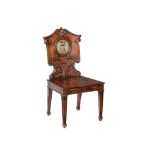 A MAHOGANY HALL CHAIR IN THE REGENCY MANNER
