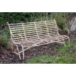 A REGENCY IRON STRAPWORK GARDEN BENCH