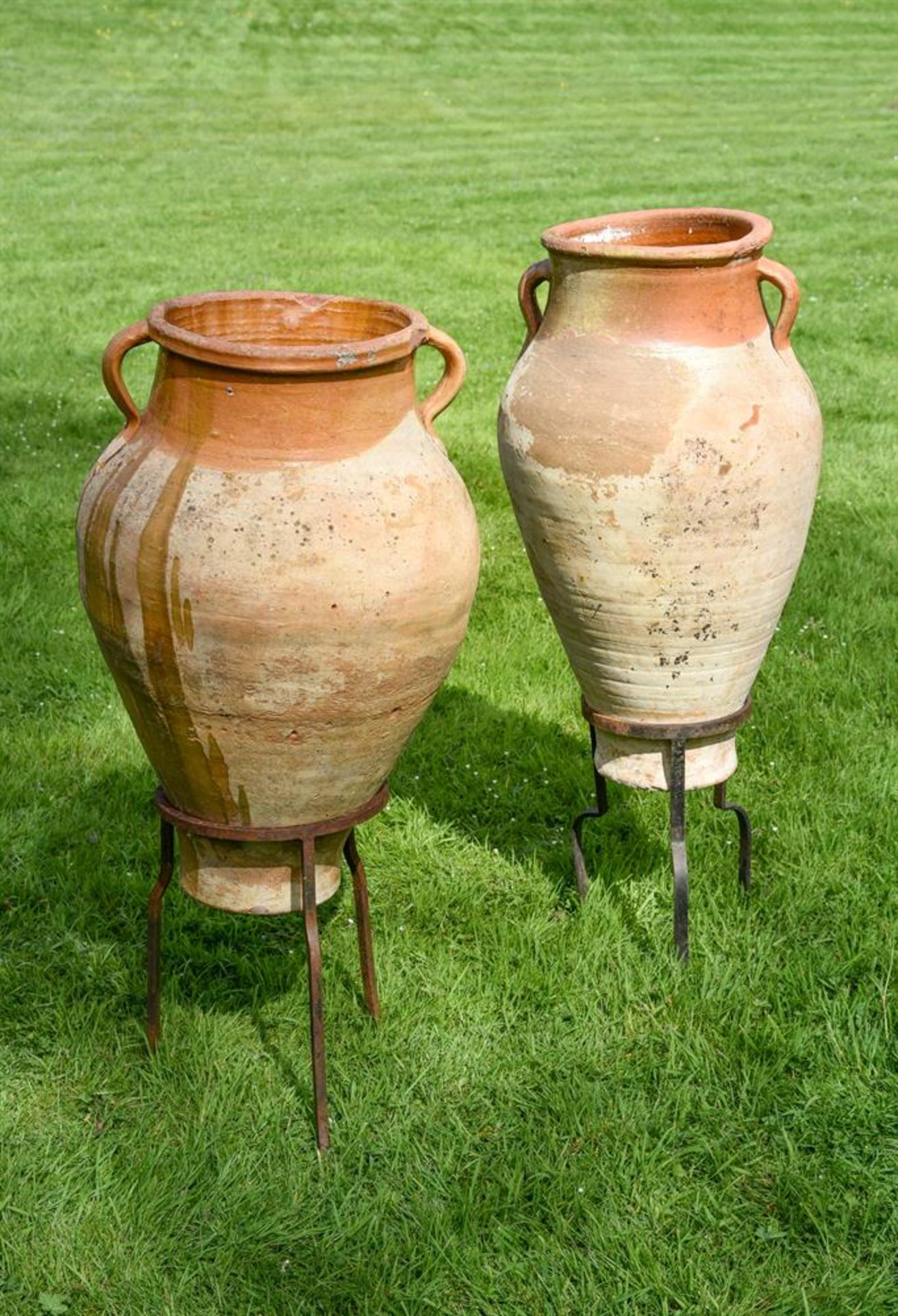 TWO SIMILAR TERRACOTTA AMPHORA ON STANDS