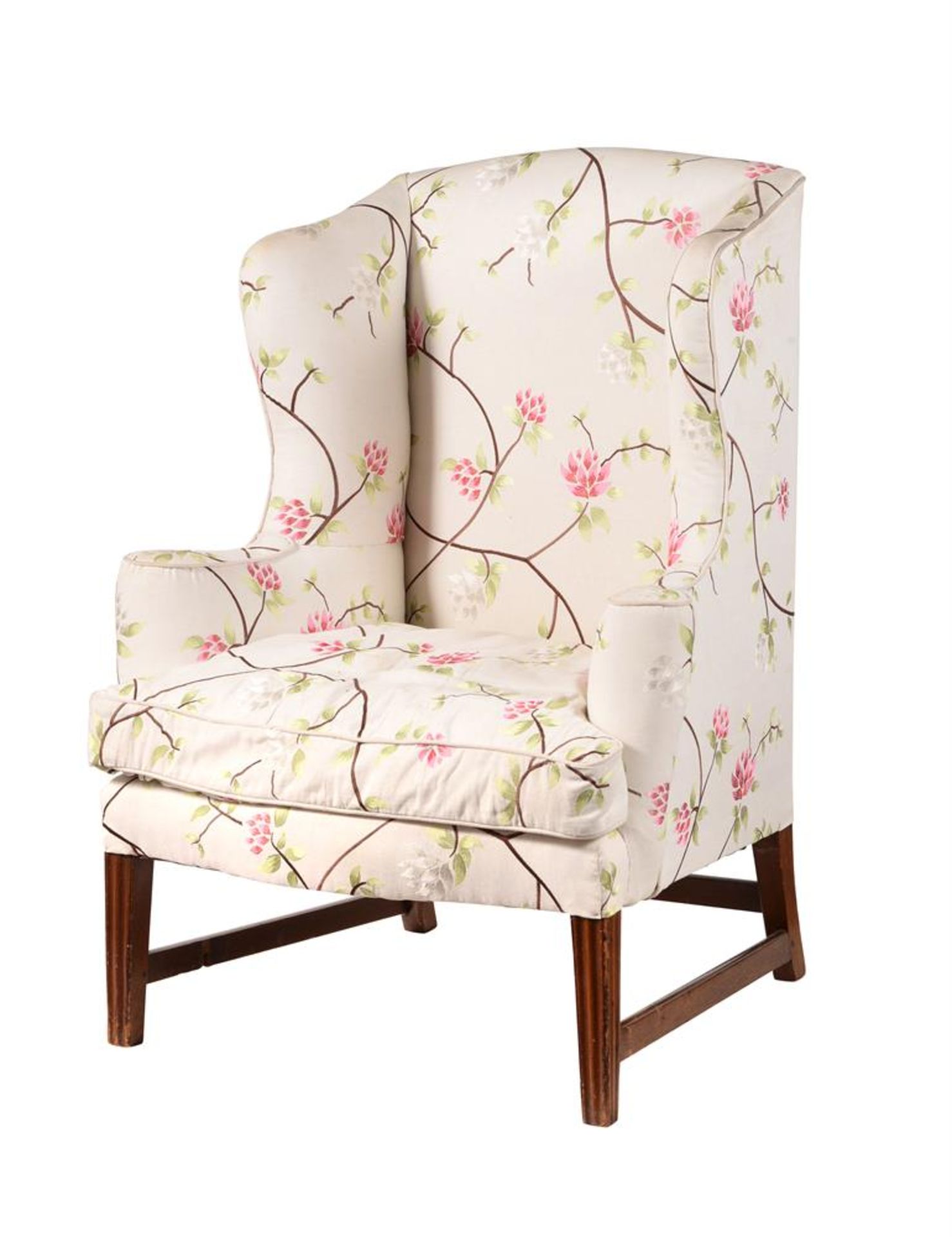 A MAHOGANY AND UPHOLSTERED WING ARMCHAIR IN GEORGE III STYLE