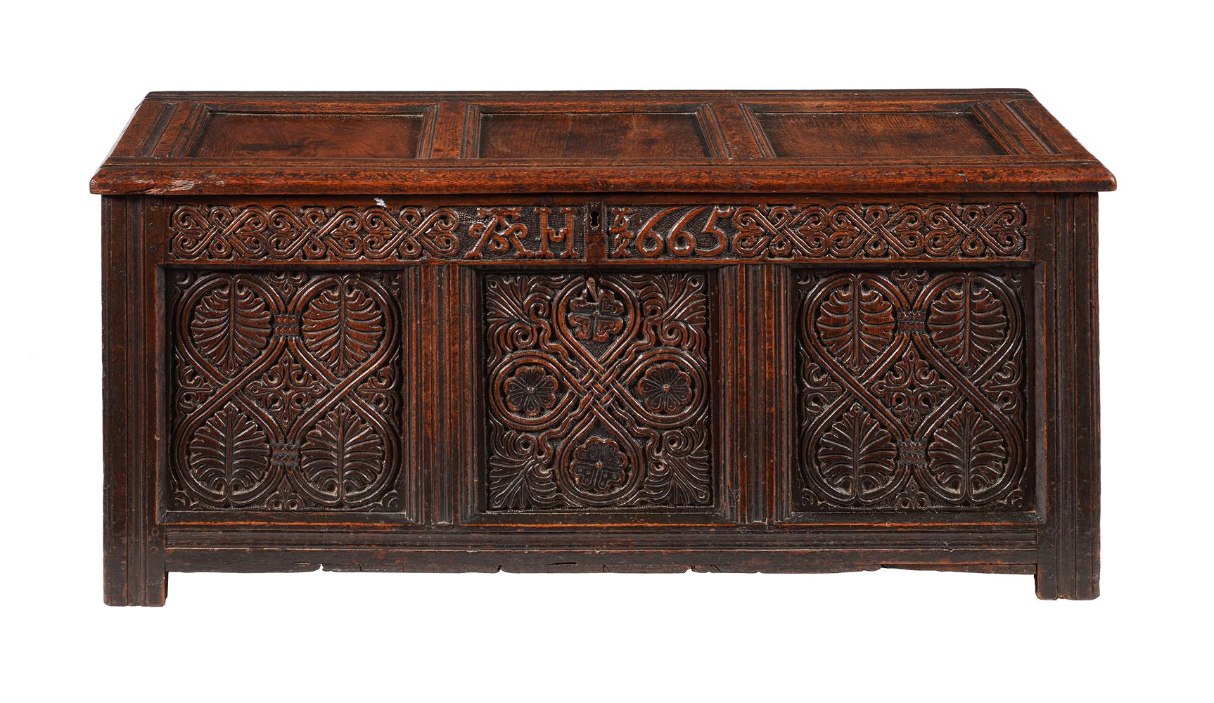 A CHARLES II CARVED OAK CHEST