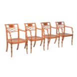 A SET OF FOUR SATINWOOD AND PAINTED ARMCHAIRS IN REGENCY TASTE
