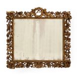 A CARVED GILTWOOD WALL MIRROR