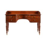 A GEORGE IV MAHOGANY DRESSING TABLEIN THE MANNER OF GILLOWS