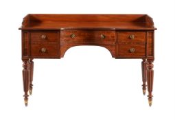 A GEORGE IV MAHOGANY DRESSING TABLEIN THE MANNER OF GILLOWS