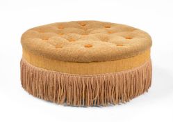 AN UPHOLSTERED CIRCULAR CENTRE FOOTSTOOL IN VICTORIAN TASTE
