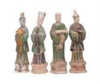 A GROUP OF FOUR SANCAI-GLAZED POTTERY FIGURES OF OFFICIALS IN TANG STYLE