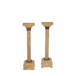 A PAIR OF SIENA MARBLE TORCHERE STANDS