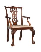 A CARVED MAHOGANY ARMCHAIR