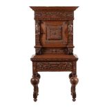 A FLEMISH OAK CABINET ON STAND