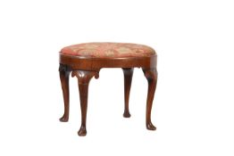 A WALNUT OVAL STOOL, IN QUEEN ANNE STYLE