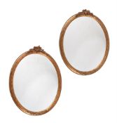 A PAIR OF GILT GESSO OVAL WALL MIRRORS