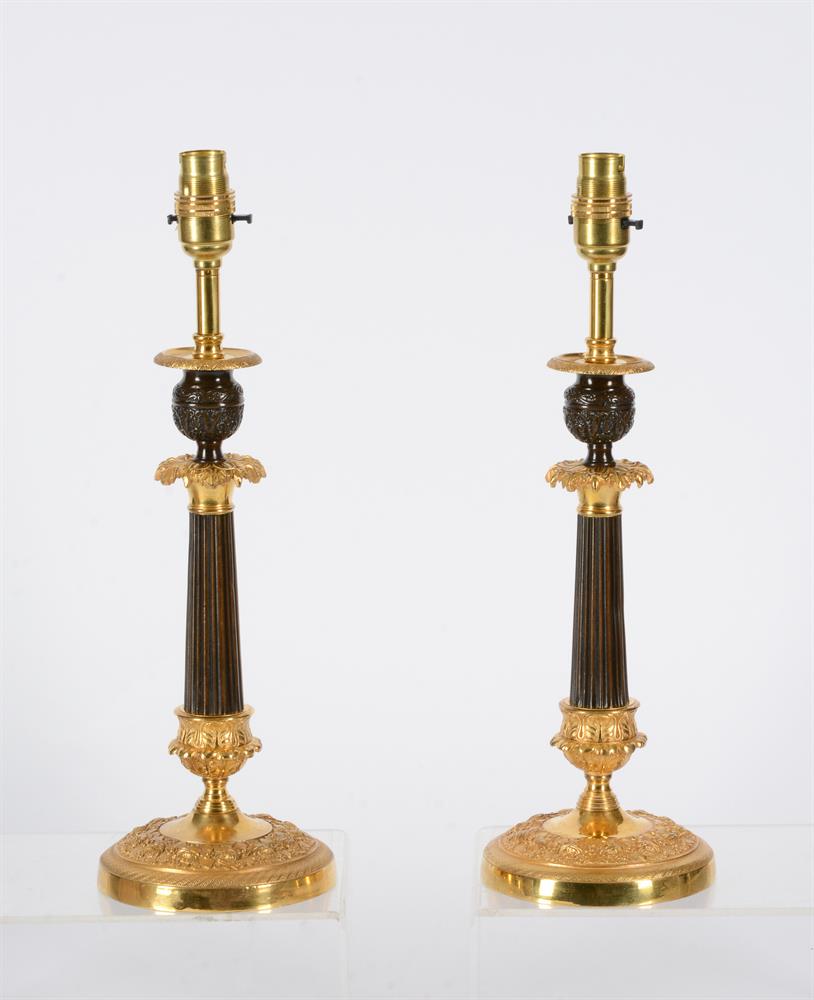 A PAIR OF PARCEL GILT AND PATINATED BRONZE CANDLESTICKS - Image 2 of 2