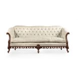 A CARVED WALNUT AND UPHOLSTERED SOFA