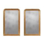 A PAIR OF FRENCH GILTWOOD AND COMPOSITION WALL MIRRORS OR OVERMANTEL MIRRORS