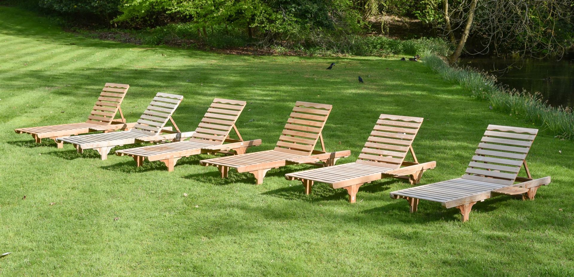 A SET OF SIX TEAK 'STEAMER' RECLINERS