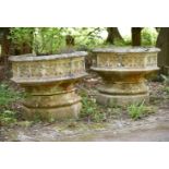 A PAIR OF STONE COMPOSITION GARDEN PLANTERS, IN GOTHIC TASTE