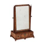A GEORGE II WALNUT AND FEATHER BANDED DRESSING MIRROR