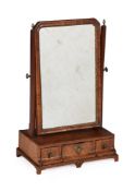 A GEORGE II WALNUT AND FEATHER BANDED DRESSING MIRROR