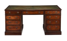 A MAHOGANY TWIN PEDESTAL PARTNER'S DESK IN GEORGE III STYLE