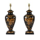 A PAIR OF BLACK AND GILT DECORATED POTTERY TABLE LAMPS IN REGENCY TASTE