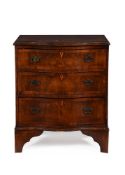 A WALNUT AND CROSSBANDED SERPENTINE FRONTED CHEST OF DRAWERS IN 18TH CENTURY STYLE