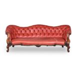 A VICTORIAN WALNUT AND LEATHER SOFA