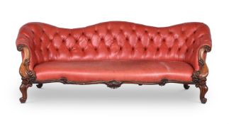 A VICTORIAN WALNUT AND LEATHER SOFA
