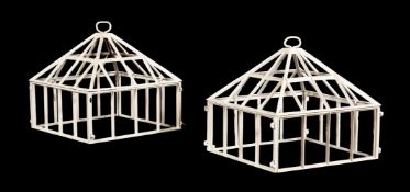 A PAIR OF WHITE PAINTED METAL CLOCHES IN VICTORIAN STYLE