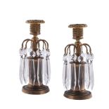 A PAIR OF REGENCY GILT BRASS AND GLASS HUNG LUSTRE CANDLESTICKS