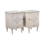 A PAIR OF WHITE PAINTED BEDSIDE TABLES IN SWEDISH STYLE