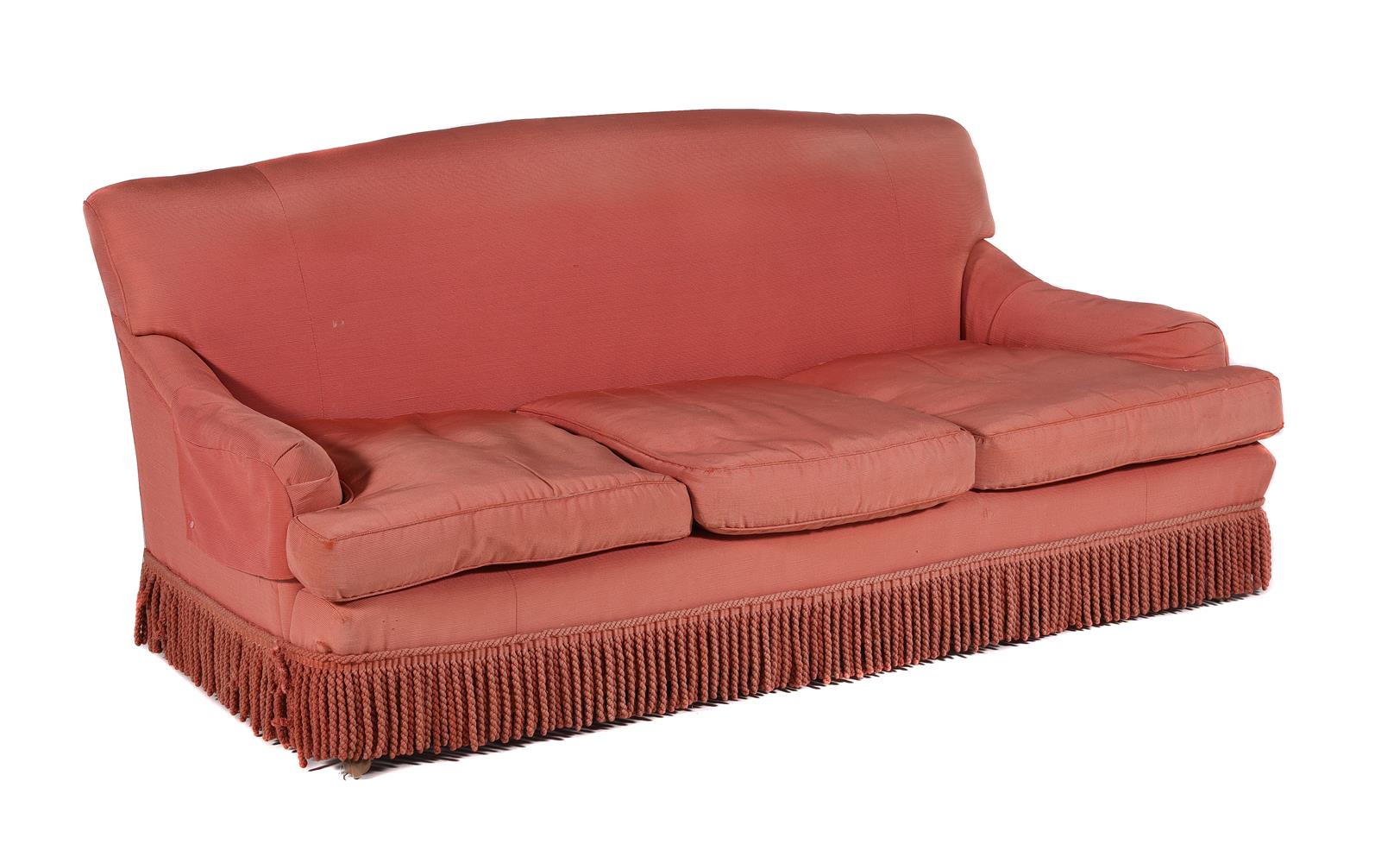 A PAIR OF CORAL PINK UPHOLSTERED THREE SEAT SOFAS