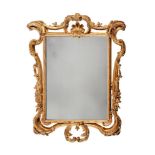 A GILTWOOD WALL MIRROR