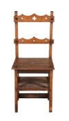 A VICTORIAN OAK METAMORPHIC LIBRARY CHAIR