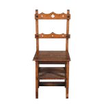 A VICTORIAN OAK METAMORPHIC LIBRARY CHAIR