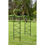 A BLACK PAINTED IRON WROUGHT IRON GARDEN ARCH