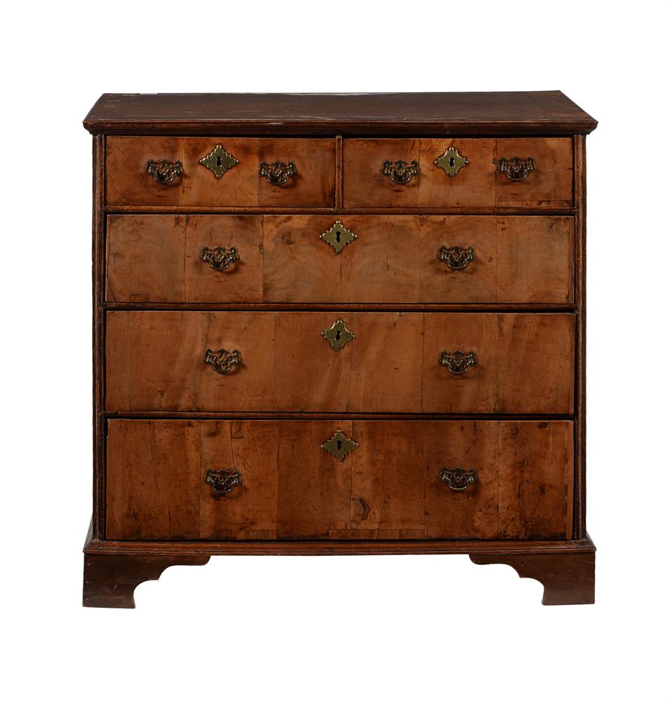 A WALNUT CHEST OF DRAWERS