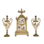 A FRENCH GILT BRASS AND GLASS-BEAD HIGHLIGHTED PORCELAIN MANTEL CLOCK GARNITURE