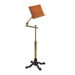 A VICTORIAN CAST-IRON, BRASS, AND OAK METAMORPHIC READING STAND