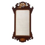 AN EDWARDIAN MAHOGANY AND INLAID FRET FRAME MIRROR IN GEORGE II STYLE